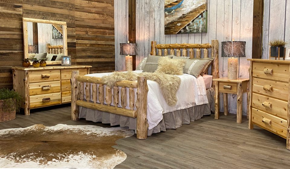 a beautiful, rustic room comprised of a variety of log furniture